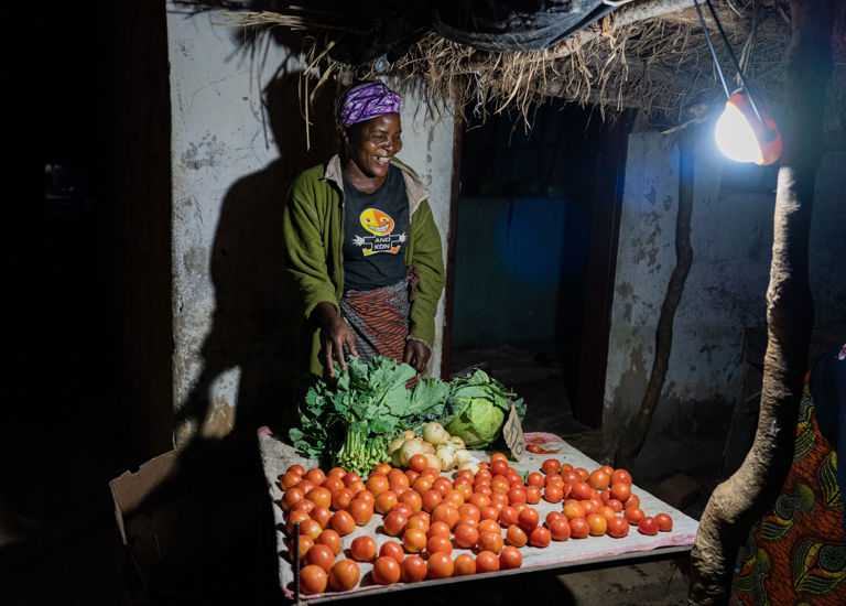 A Trader Uses Her Light To Sell Her Produce At The Local Market. Photo Credit Solaraid Jason J Mulikita